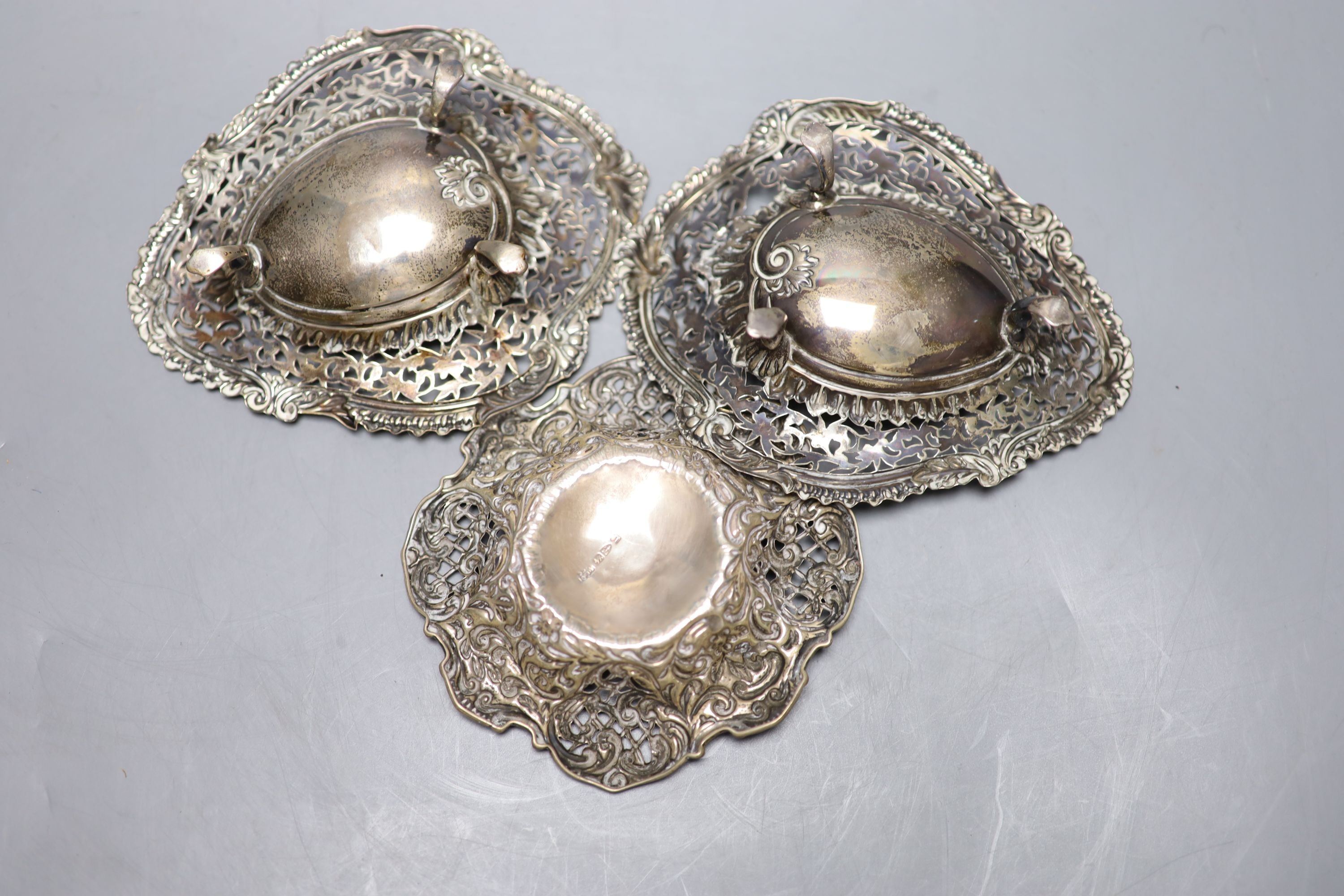 A pair of late Victorian silver shaped oval bonbon dishes, Birmingham, 1894, 13.9cm and one other pierced silver bonbon dish.